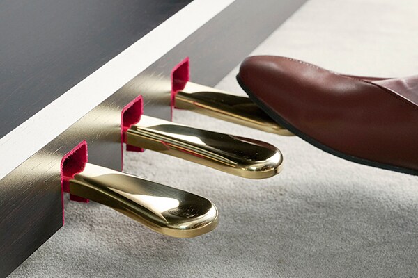 A right foot pressing the damper pedal