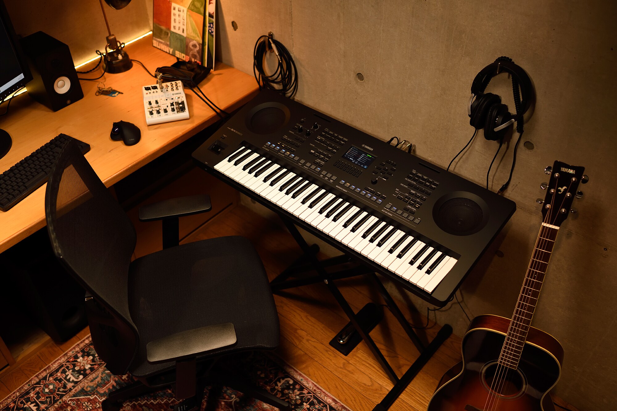 A home music workspace with a computer and keyboard