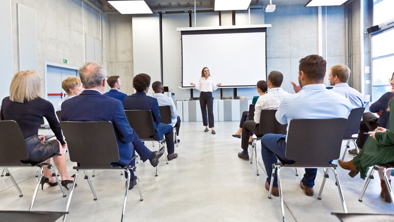 Photo showing a woman giving a presentation