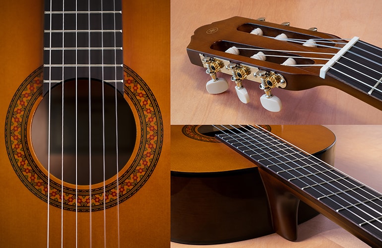 Close up of the head and tuners, neck, and soundhole of the C40 and C70 acoustic guitars.