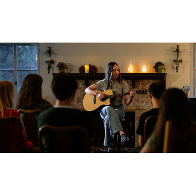 Musician performing in front of an audience with the TAS3 C acoustic guitar.