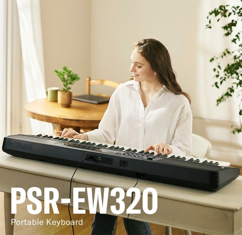 Woman absorbed in playing the PSR-EW320.